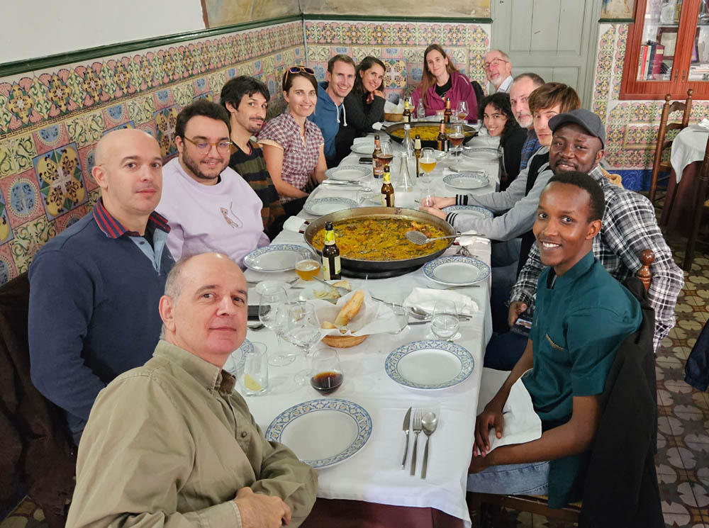 Gilytics team enjoying paella