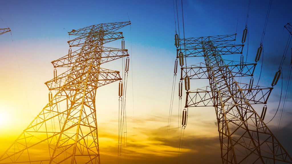 Hight voltage power towers in sunset
